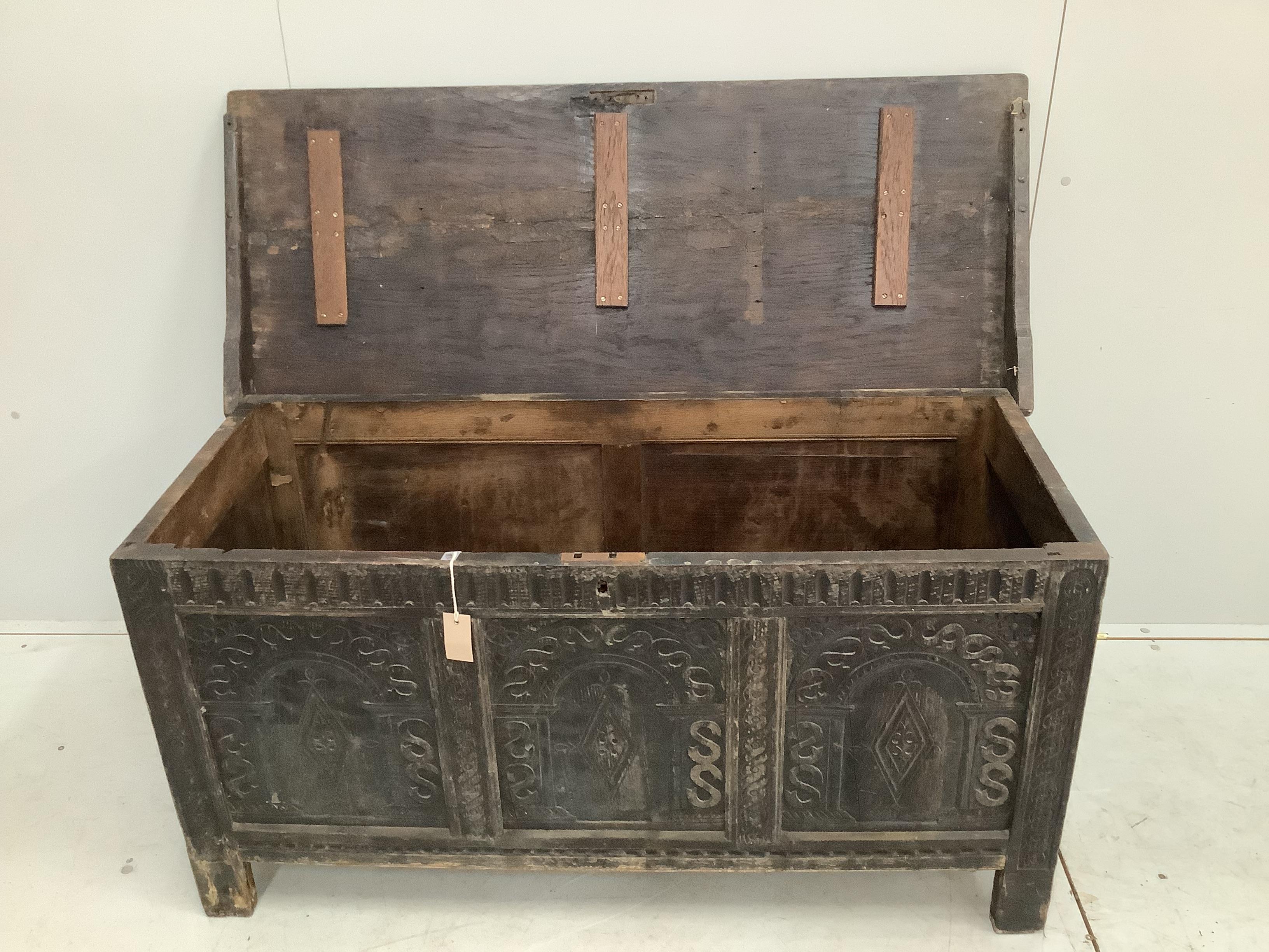 A 17th century style oak coffer, width 127cm, depth 53cm, height 64cm